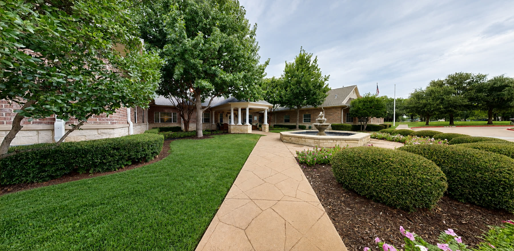 Garden walkway leading to the courtyard fountain